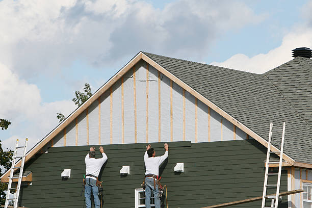 Professional Storm Damage Siding Repair technician working in Wendel, PA